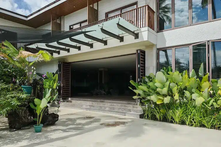 Aluminum framed swing door with floor spring & Steel canopy in Nouveau Resort