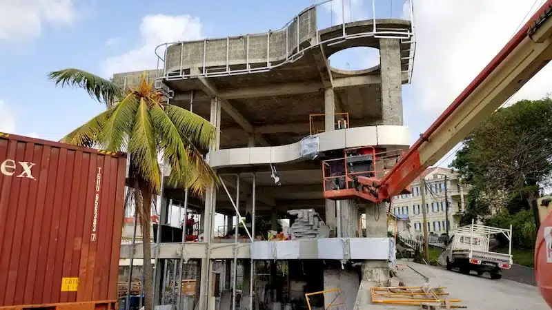 Boom lift installing curved façade panels