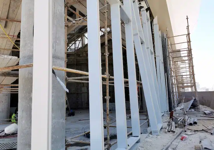 Aluminum panel curtain wall substructure installation with post-installed anchors